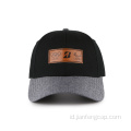 Topi baseball 6 panel dengan logo custom timbul